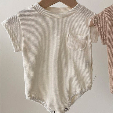 beige katoenen romper baby – Annie & Charles